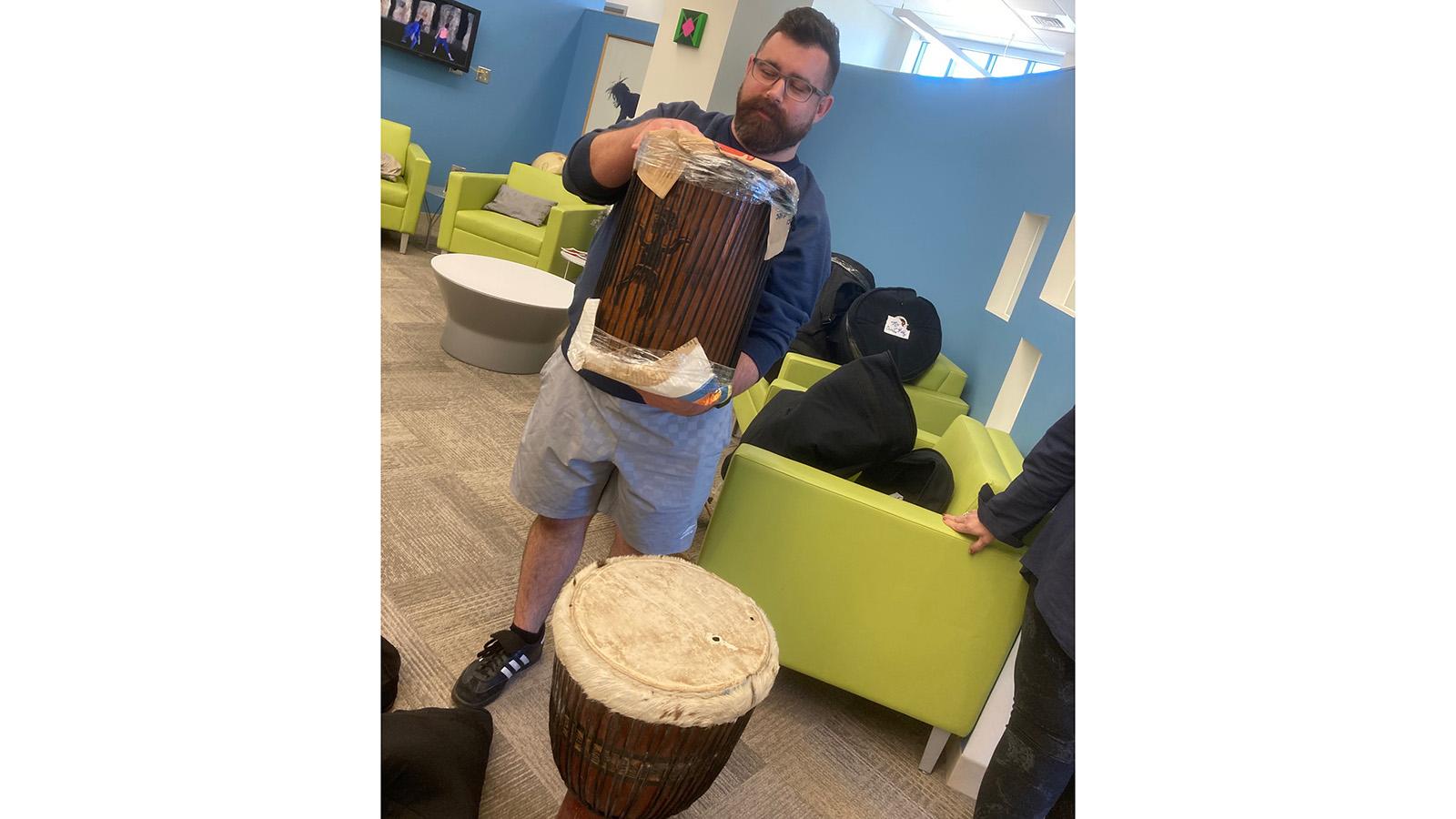 Man holding African drum